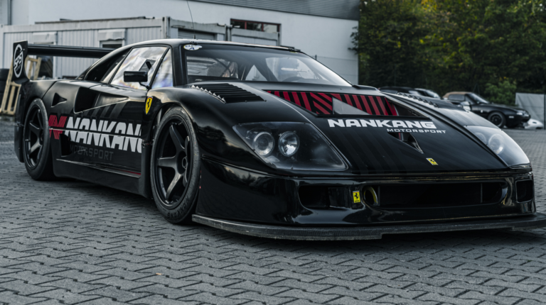 A black race car with Nankang Tyre branding across the hood