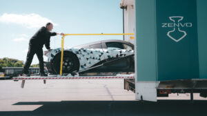 The Zenov Aurora is maneuvered into a transportation truck