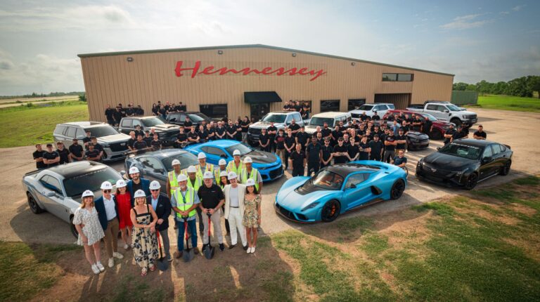 Hennessey breaks ground on manufacturing expansion to meet growing demand Hennessey staff and a range of the company's vehicles pose outside the front of a Hennessey building