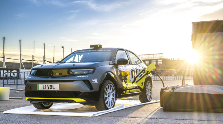 ADAC Opel GSE Rally Cup sees performance increase with Mokka in and Corsa out Opel Mokka GSE Rally charing outside in the sun at a race track