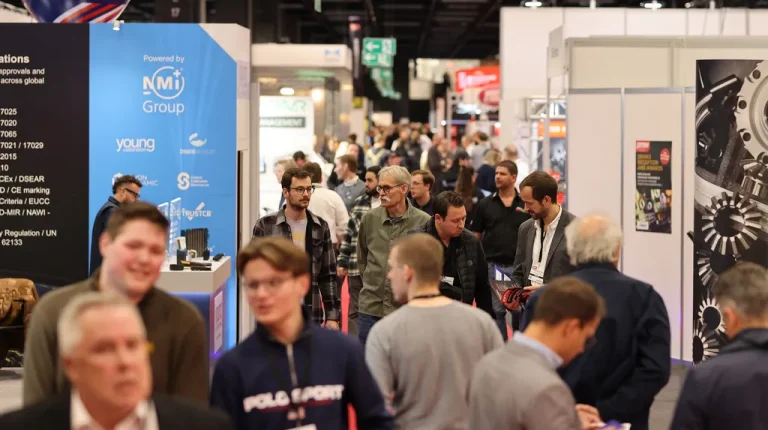 PMW Expo 2025 roundup The busy show floor or PMW Expo exhibition, with people walking between long cordidor or stalls and stands.