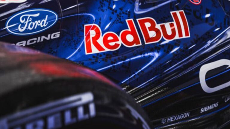 Close-up of the Red Bull and Ford Racing branding on an F1 car.