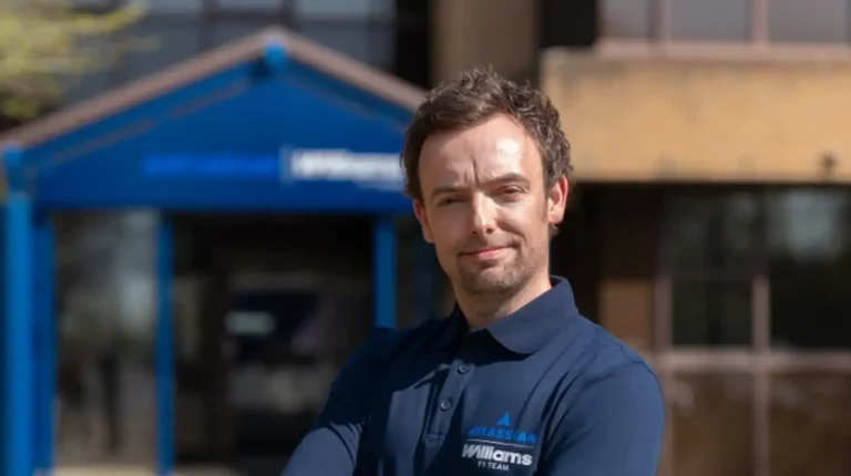 Dan Milner stands in front of Williams F1 Team offices.