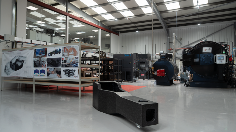 A Dash-CAE manufacturing facility with large equipment.