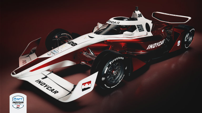 IndyCar unveils all-new IR-28 race car Promo pic of the new IR-28 IndyCar race car against a black and red background.