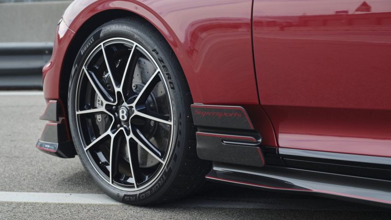 Close up of the Pirelli P Zero tire on a red Bentley Supersports